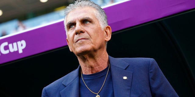 Iran's head coach Carlos Queiroz looks on ahead the start of the World Cup Group B soccer match between Wales and Iran, at the Ahmad Bin Ali Stadium in Al Rayyan, Qatar, Friday, Nov. 25, 2022. 