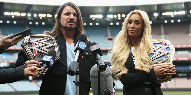 WWE World Champion AJ Styles and Smackdown Women's Champion Carmella speak at the Melbourne Cricket Ground on June 24, 2018 in Melbourne, Australia. 