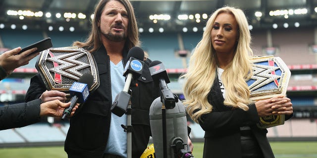 WWE World Champion AJ Styles and Smackdown Women's Champion Carmella speak at the Melbourne Cricket Ground on June 24, 2018 in Melbourne, Australia.