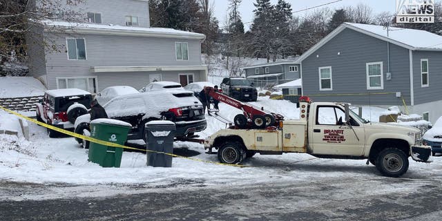 Five cars were towed away from a home where four University of Idaho students were murdered. 