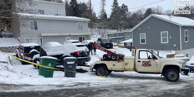 Five cars were towed away from a home where four University of Idaho students were murdered.