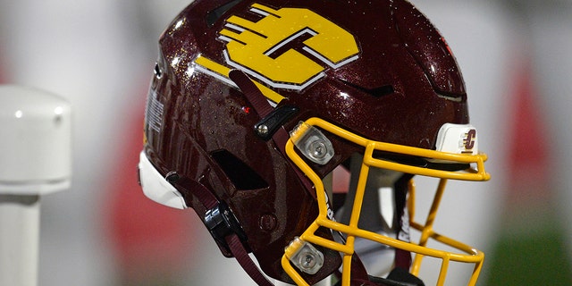 A Central Michigan Chippewas helmet sits on the back of the team bench during the college football game between the Central Michigan Chippewas and the Ball State Cardinals on Nov. 17, 2021, at Scheumann Stadium in Muncie, Indiana.