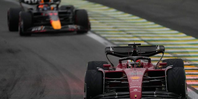Ferrari driver Charles Leclerc, of Monaco, steers his car ahead of Red Bull driver Sergio Perez, of Mexico, during a qualifying session for the Brazilian Formula One Grand Prix at the Interlagos Racetrack in Sao Paulo Friday, Nov. 11, 2022. 