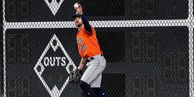 Houston Astros left fielder Chas McCormick celebrates his catch of a fly ball hit by Philadelphia Phillies' J.T. Realmuto during the ninth inning in Game 5 of baseball's World Series between the Houston Astros and the Philadelphia Phillies on Thursday, Nov. 3, 2022, in Philadelphia.
