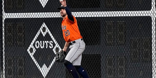 Houston Astros left fielder Chas McCormick celebrates his catch of a fly ball hit by Philadelphia Phillies' J.T. Realmuto during the ninth inning in Game 5 of baseball's World Series between the Houston Astros and the Philadelphia Phillies on Thursday, Nov. 3, 2022, in Philadelphia.
