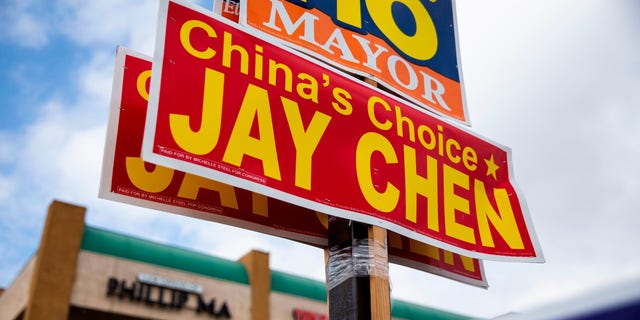 Signs against Jay Chen outside a shopping mall in Westminster, California, on Oct. 22, 2022.