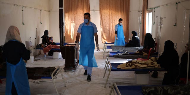 Syria's poor water supply and lack of medical care exacerbate the cholera outbreak in the country's provinces.  Pictured, nurses monitor cholera patients in the cholera ward of the Al-Rahma hospital in Darkush city. 