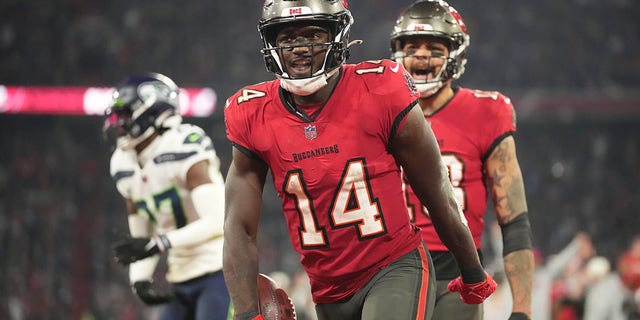 Tampa Bay Buccaneers' Chris Godwin reacts after a touchdown catch against the Seattle Seahawks, Sunday, Nov. 13, 2022, in Munich, Germany.