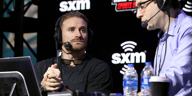 Former NFL player, Chris Long and SiriusXM host Adam Schein speak onstage during day 2 of SiriusXM at Super Bowl LIV on Jan.  30, 2020 in Miami.
