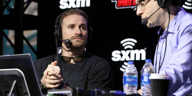 Former NFL player, Chris Long and SiriusXM host Adam Schein speak onstage during day 2 of SiriusXM at Super Bowl LIV on Jan. 30, 2020 in Miami.