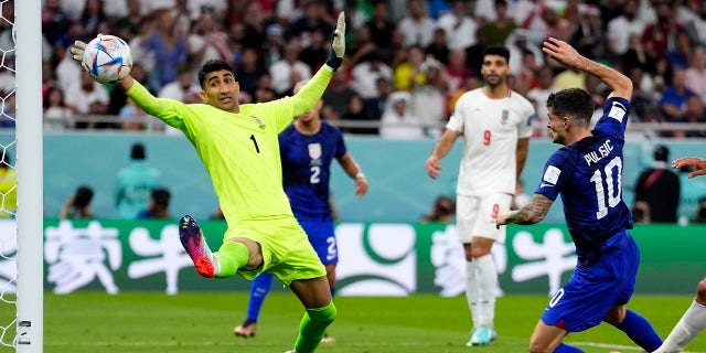 Christian Pulisic beats Iran's goalkeeper Alireza Beiranvand in Doha, Qatar, Tuesday, November 29, 2022.
