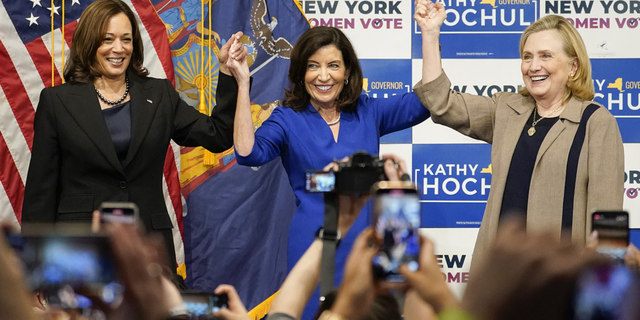 Vice President Kamala Harris, left, New York Gov. Kathy Hochul, center and former Secretary of State Hillary Clinton, stand together on stage during a campaign event for Hochul on Nov. 3, 2022, at Barnard College in New York. 