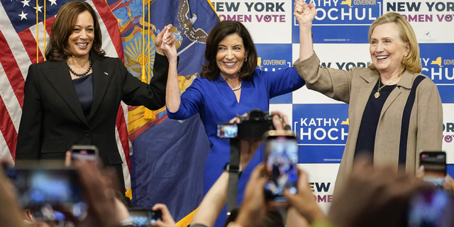 Vice President Kamala Harris, left, New York Gov. Kathy Hochul, center and former Secretary of State Hillary Clinton, stand together on stage during a campaign event for Hochul on Nov. 3, at Barnard College in New York. 