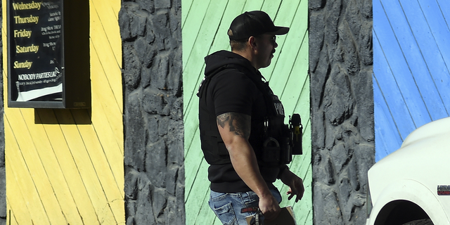 A police officer walks outside of Club Q in Colorado Springs, Colorado, on Tuesday, Nov. 22.