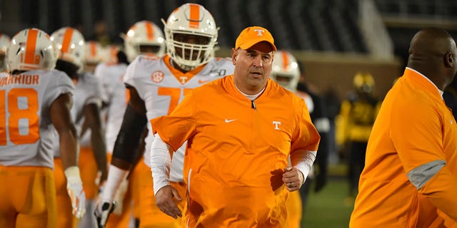 Head coach Jeremy Pruitt of the Tennessee Volunteers leads his team onto the field against the Missouri Tigers at Memorial Stadium on November 23, 2019 in Columbia, Missouri.
