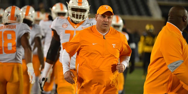 Head coach Jeremy Pruitt of the Tennessee Volunteers leads his team onto the field against the Missouri Tigers at Memorial Stadium on November 23, 2019 in Columbia, Missouri.