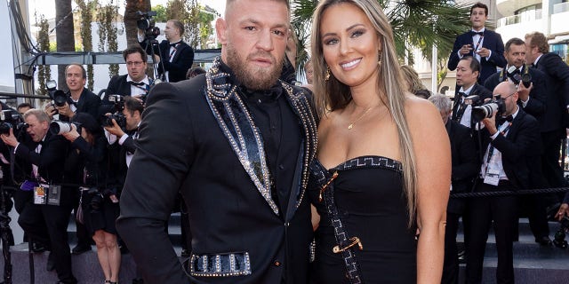 Conor McGregor and Dee Devlin attend the screening of "Elvis" during the 75th annual Cannes Film Festival at Palais des Festivals on May 25, 2022 in Cannes, France.