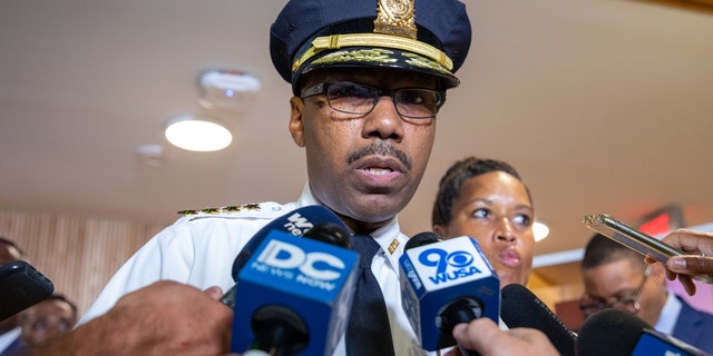 DC Police chief Robert J. Contee III, alongside Mayor Muriel Bowser, speaks during a press conference on the first day of classes at School Within School in Washington, D.C. on August 29, 2022. 