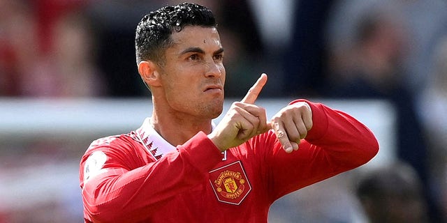 The English Football Association has suspended former Manchester United striker Cristiano Ronaldo for two games and fined him for slapping a fan's phone from his hand after a game in April.