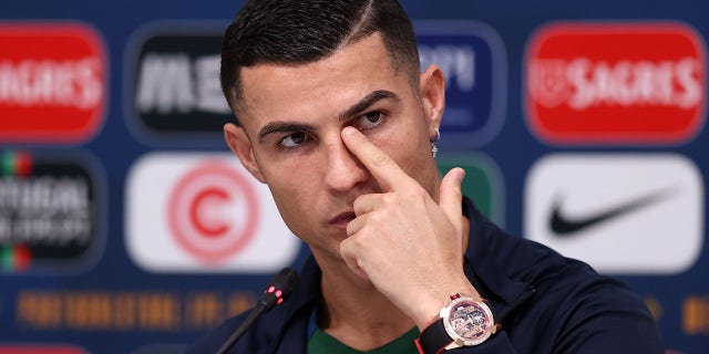 Cristiano Ronaldo reacts during a press conference in Doha, Qatar on Monday.