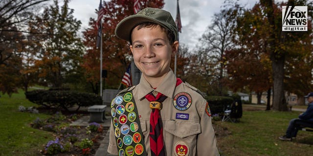 BSA Life Scout Dylan Smith, 13, displays his merit badges in Sleepy Hollow, New York, on Veterans Day, Nov. 11, 2022. He completed his Eagle Scout service project, which is a memorial to World War II veteran and local legend Armando "Chick" Galella. 
