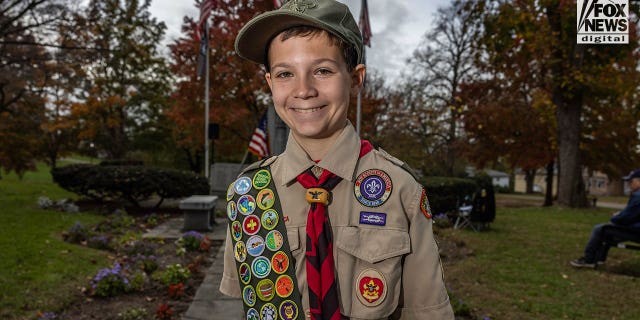 BSA Life Scout Dylan Smith, 13, displays his merit badges in Sleepy Hollow, New York, on Veterans Day, Nov. 11, 2022. He completed his Eagle Scout service project, which is a memorial to World War II veteran and local legend Armando "Chick" Galella.