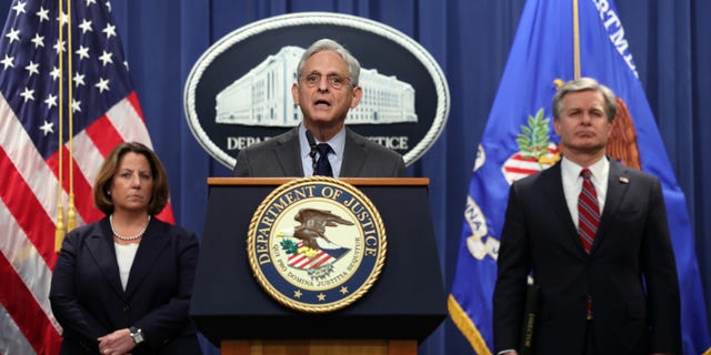 Attorney General Merrick Garland, center, FBI Director Christopher Wray and Deputy Attorney General Lisa Monaco hold a press conference at the U.S. Department of Justice in Washington, D.C., on Oct. 24, 2022.