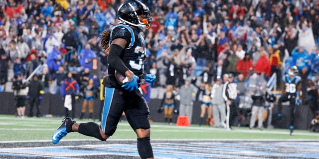 No. 33 D'Onta Foreman of the Carolina Panthers scores a touchdown in the third quarter against the Atlanta Falcons at Bank of America Stadium.