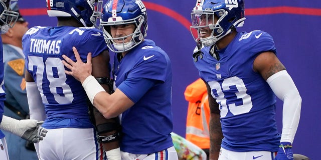 New York Giants quarterback Daniel Jones celebrates with teammates after they scored a touchdown against the Houston Texans, Sunday, Nov. 13, 2022, in East Rutherford, New Jersey.