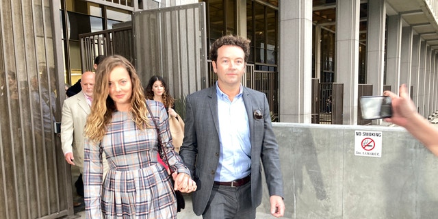 Danny Masterson leaves Los Angeles superior court with wife Bijou Phillips following mistrial.
