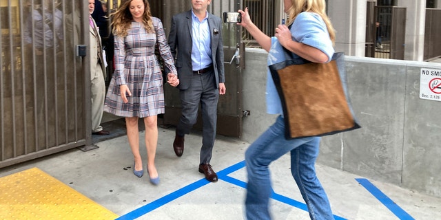 Danny Masterson and wife Bijou Phillips leave a Los Angeles superior court following his mistrial.