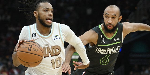 Cavaliers guard Darius Garland drives against Minnesota Timberwolves guard Jordan McLaughlin at Rocket Mortgage FieldHouse in Cleveland on Nov. 13, 2022.