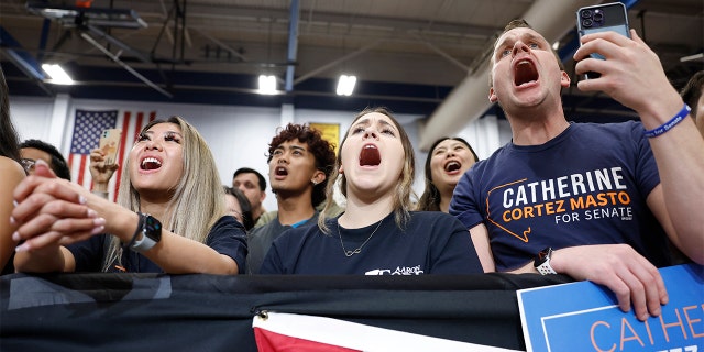 Supporters yell "vote" as former President Obama speaks at a campaign rally in support of Nevada Democrats at Cheyenne High School on Nov. 1, 2022, in North Las Vegas.