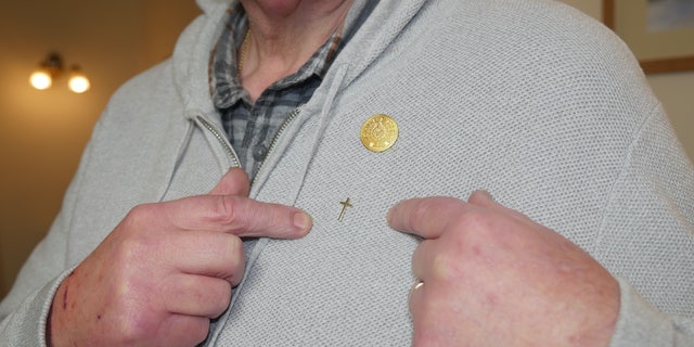 Chaplain Derek Timms said the controversy over his small cross pin led to "a crisis of conscience," and warned Christianity is "canceling itself" with "interfaith ideology."