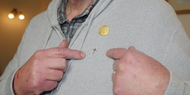 Chaplain Derek Timms said the controversy over his small cross pin led to "a crisis of conscience," and warned Christianity is "canceling itself" with "interfaith ideology."