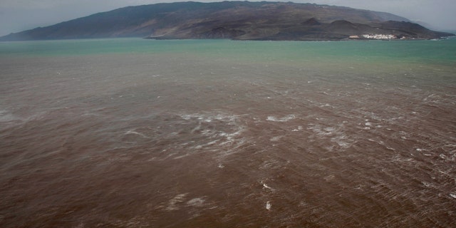 Aerial view taken on Oct. 17, 2011, of a green and brown stain at sea off the coast of the village of La Restinga on the Spanish Canary Island of El Hierro.