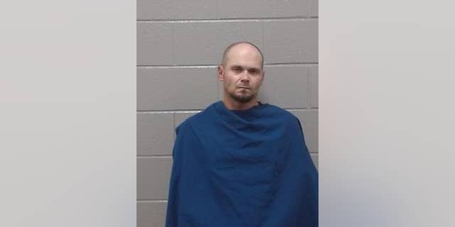 Mugshot of Robert Ellis, 38, who was charged with robbery and failure to identify after allegedly stuffing eggnog in his pants.