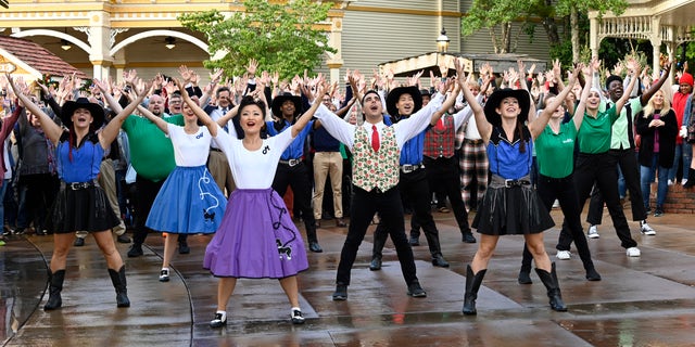 An ensemble cast dances through the streets of Dollywood in "Mountain Magic Christmas."