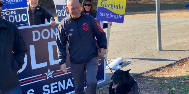 Republican Senate candidate and former General Don Bolduc arrives to vote on Election Day 2022, in Stratham, New Hampshire, November 8, 2022
