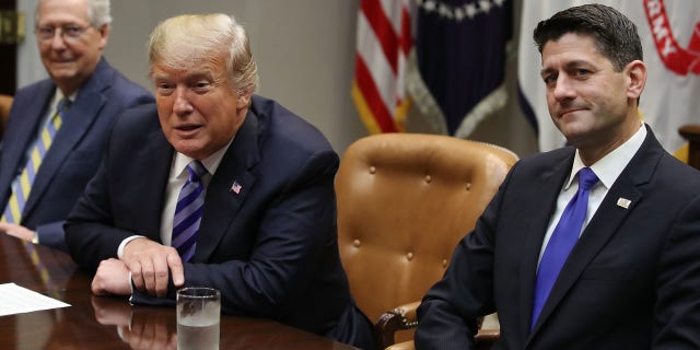 Senate Minority Leader Mitch McConnell, left, former President Donald Trump, center, and former House Majority Leader Paul Ryan