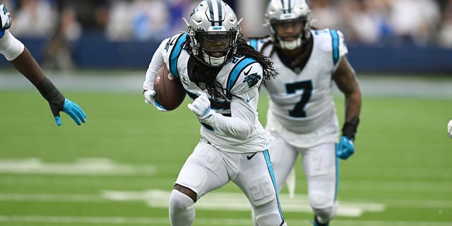Donte Jackson (26) of the Carolina Panthers runs the ball while playing the Los Angeles Rams at SoFi Stadium Oct. 16, 2022, in Inglewood, Calif.