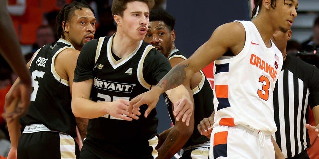 Doug Edert of the Bryant University Bulldogs reacts after slapping Judah Mintz of the Syracuse Orange on Nov. 26, 2022, in Syracuse, New York.