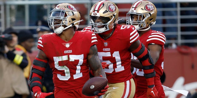 San Francisco 49ers linebacker Dre Greenlaw (57) celebrates after recovering a fumble by New Orleans Saints running back Alvin Kamara with teammates linebacker Azeez Al-Shaair (51) and safety George Odum during the second half of an NFL football game in Santa Clara, Calif., Sunday, Nov. 27, 2022.