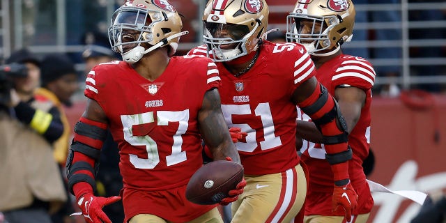 San Francisco 49ers linebacker Dre Greenlaw (57) celebrates after recovering a fumble from New Orleans Saints running back Alvin Kamara with linebacker Azeez Al-Shaair (51) and safety George Odum during the second half of an NFL football game in Santa Clara, California. ., Sunday, November 27, 2022.