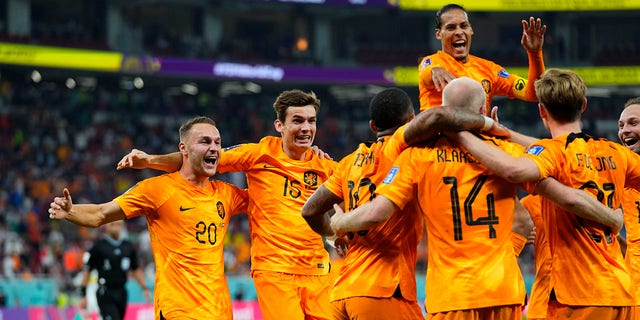Davy Klaassen of the Netherlands, 14, celebrates scoring his side's second goal with teammates during the World Cup, group A soccer match between Senegal and Netherlands at the Al Thumama Stadium in Doha, Qatar, Monday, Nov. 21, 2022. 