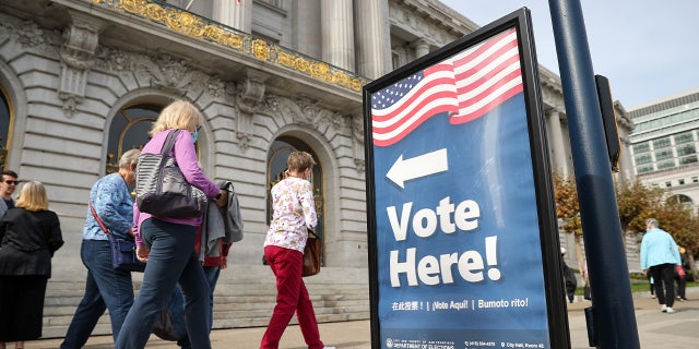A voting sign is seen outside the San Francisco City Hall as early voting continues for "Consolidated General Election" Oct. 28, 2022.
