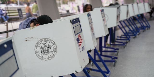 Voters casting their ballots at a polling station during early voting in Brooklyn, New York.