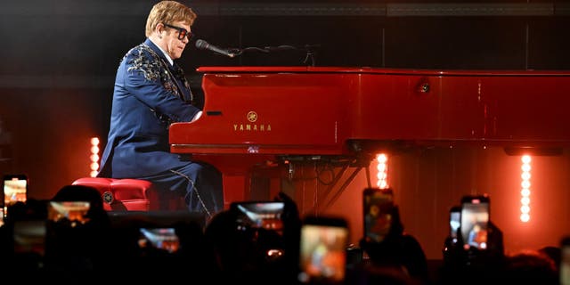 Elton John plays the piano on stage, Nov. 5.