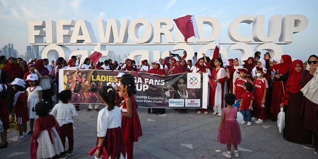 A ladies football fan group gathers by the Corniche in Doha, Qatar, on Nov. 12, 2022, one week before the 2022 FIFA World Cup begins.