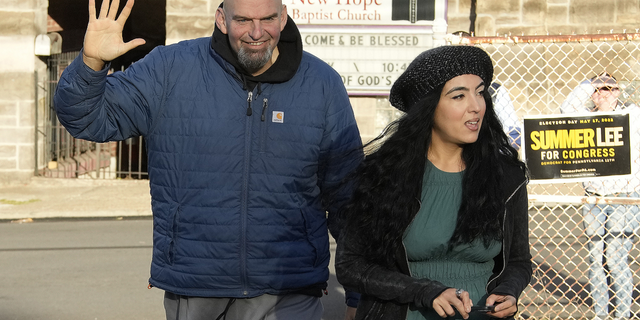 Pennsylvania Lt. Gov. John Fetterman and wife Gisele arrive to vote in Braddock, PA, on Nov. 8.